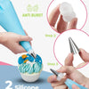 Hands are using silicone reusable bags to decorate a cake with frosting and sprinkles.