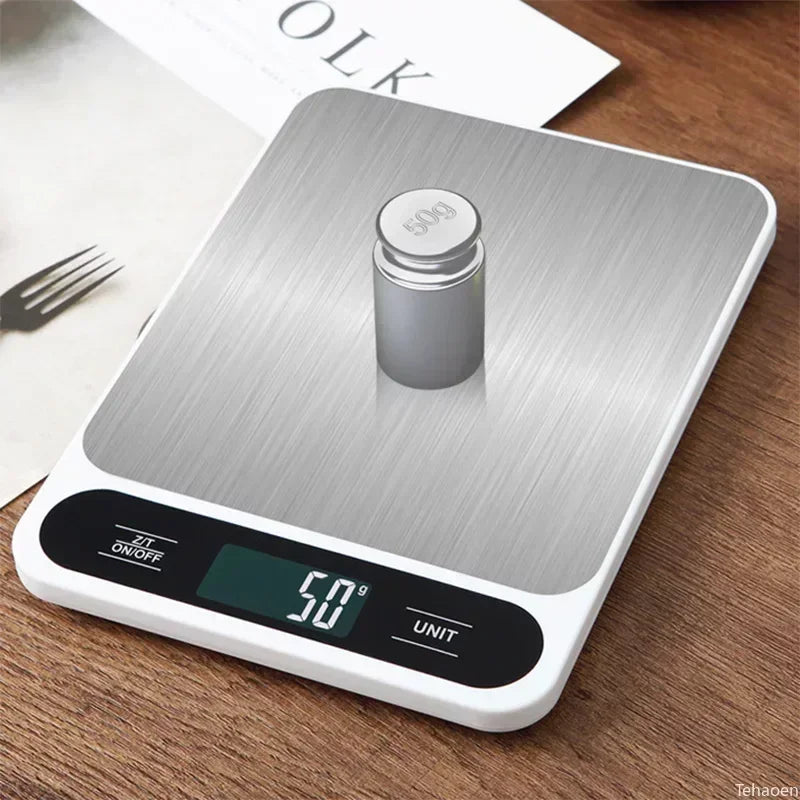 A silver digital kitchen scale is placed on a wooden surface, with a small jar of food visible.