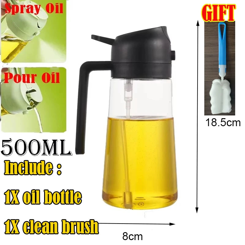 A black glass oil bottle with a spout and a handle, along with a cleaning brush, for cooking oil.