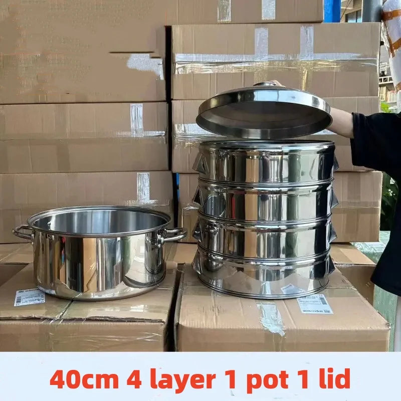 Four layers of stainless steel pots with lids stacked on cardboard boxes.