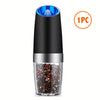 A black electric salt and pepper mill with a blue top and a glass container filled with peppercorns and coarse salt.