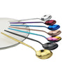 A set of six stainless steel spoons and forks in various colors, including silver, purple, and rose gold.