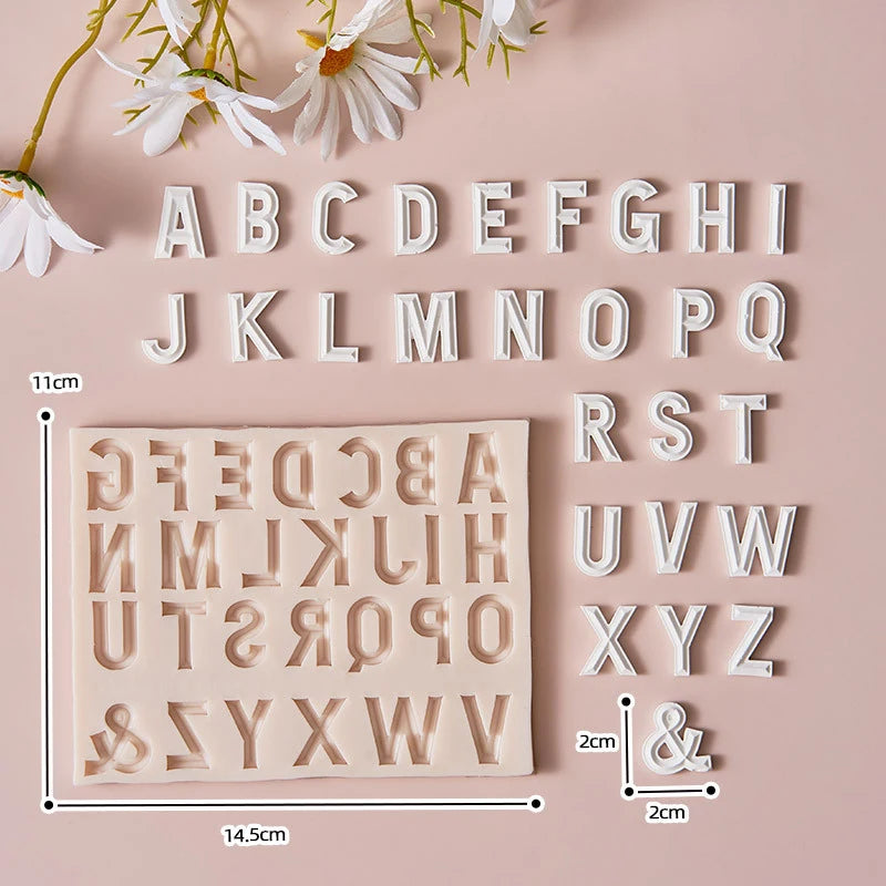 White silicone alphabet cake decoration molds showing uppercase and lowercase letters arranged in a grid