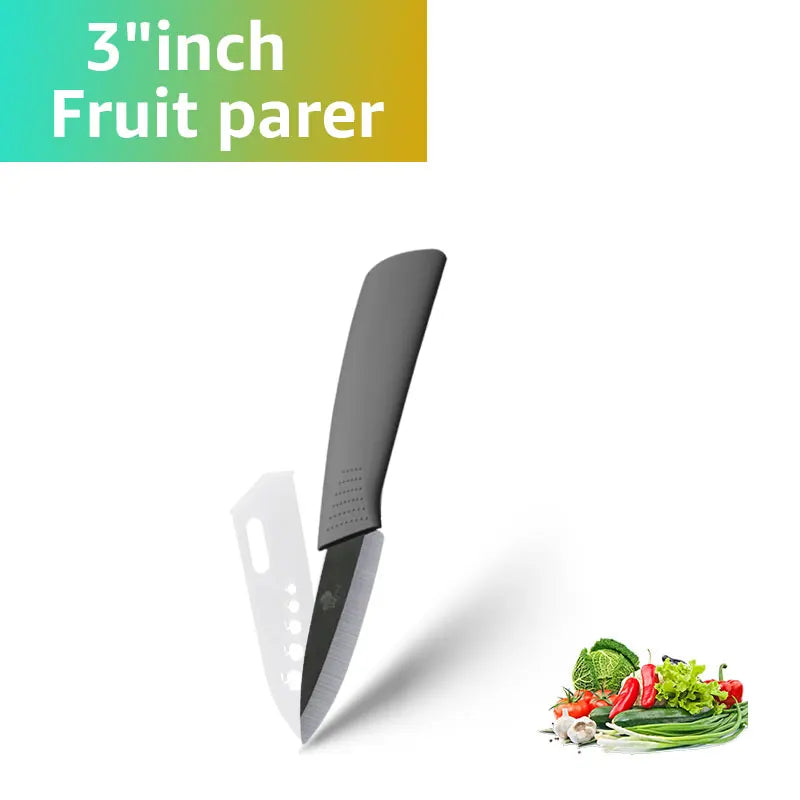 A black fruit parer knife is shown next to fresh vegetables like herbs and greens.