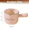 A pink ceramic espresso coffee cup with a handle, showing various volume markings and dimensions.