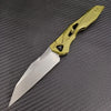 A gold-colored folding blade knife with a silver blade rests on a dark gray textured surface.