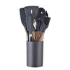 A collection of 12 silicone non-stick kitchen utensils in a dark gray holder.