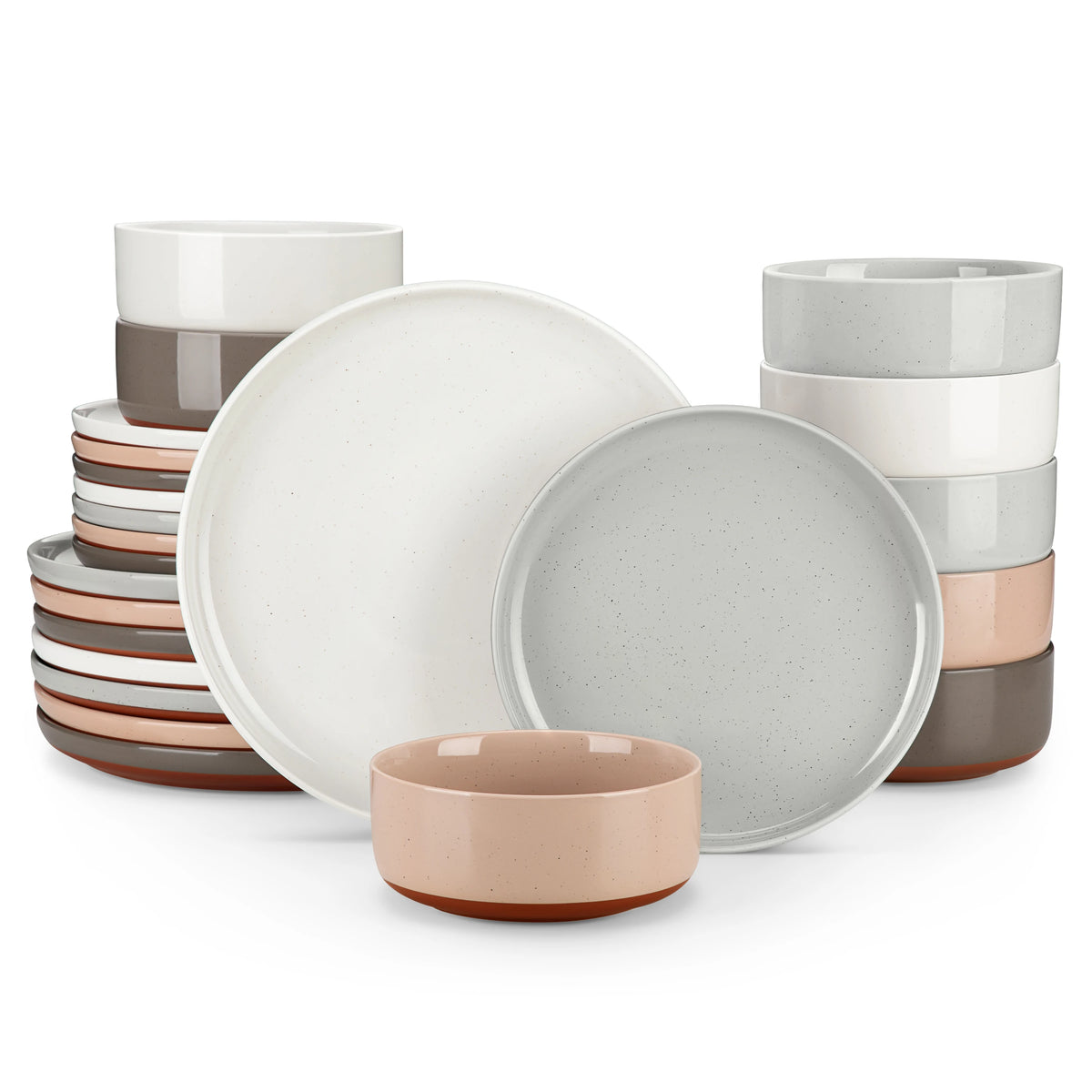 A collection of stoneware dinnerware plates and bowls in various muted earth tones, including white, gray, and terracotta.