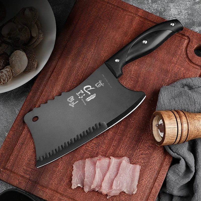 A black dual-purpose stainless steel chopping knife rests on a wooden cutting board next to sliced pink meat.