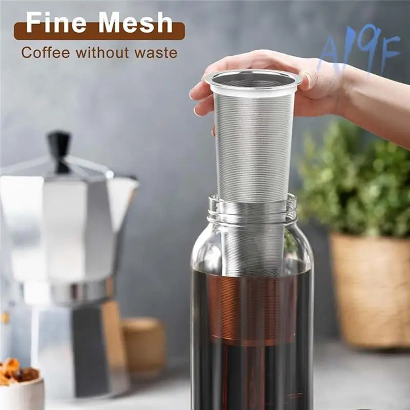 A hand holds a fine mesh coffee filter for cold brew, designed to make coffee without waste.