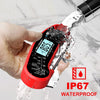 A hand is using a red digital meat thermometer to measure meat under running water.