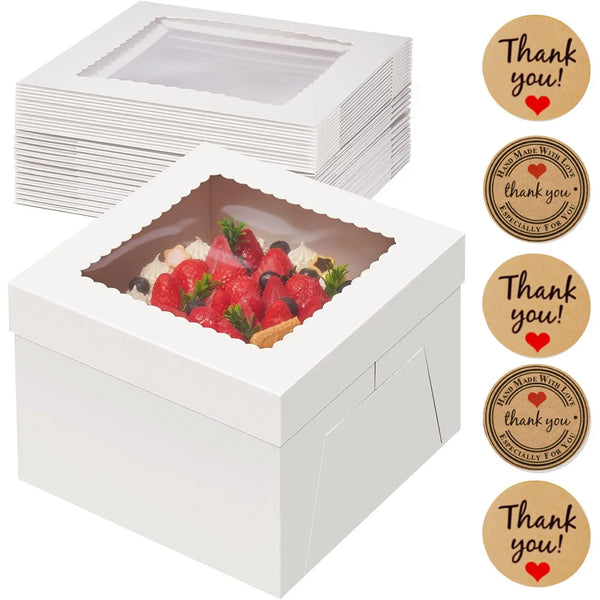 Weiße quadratische Kuchenboxen mit frischem Obst und einer Dankesbotschafts-Tag