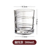 Vaso rotatorio de whiskey de vidrio transparente con medidas indicadas.