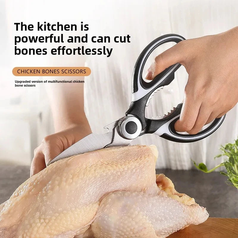 A hand uses kitchen bone scissors to cut bones from a raw chicken carcass.