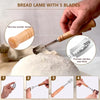 A hand uses a five-blade bread lame with a non-slip wooden handle to score a loaf of bread.