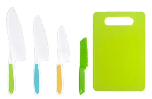 A set of plastic fruit and cake cutting tools including knives and a green cutting board.