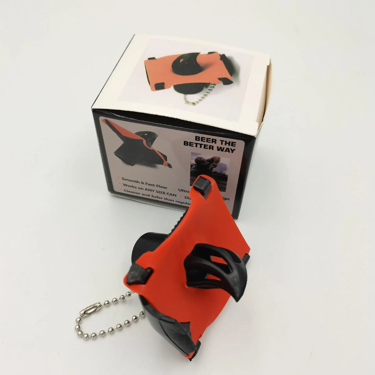 An orange and black beer bottle opener tool is shown next to its packaging box.
