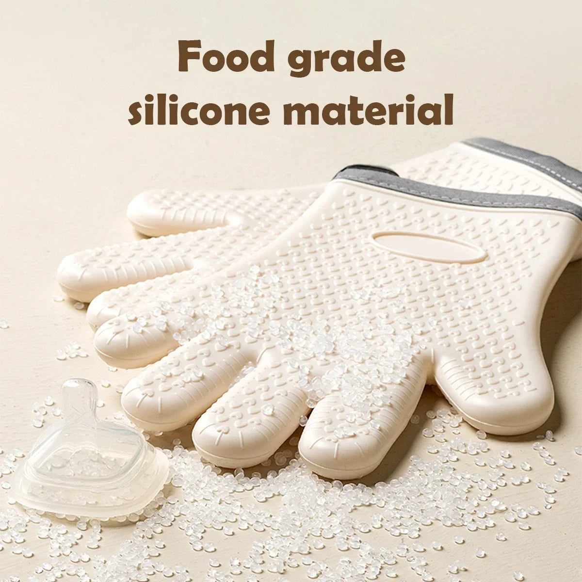 A hand-shaped food grade silicone baking glove is shown with loose white crystals scattered around it.