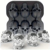 A set of silicone skull ice cube molds in black and clear glass, shown with a mold tray.