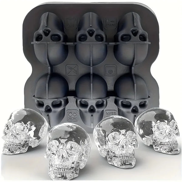 A set of silicone skull ice cube molds in black and clear glass, shown with a mold tray.