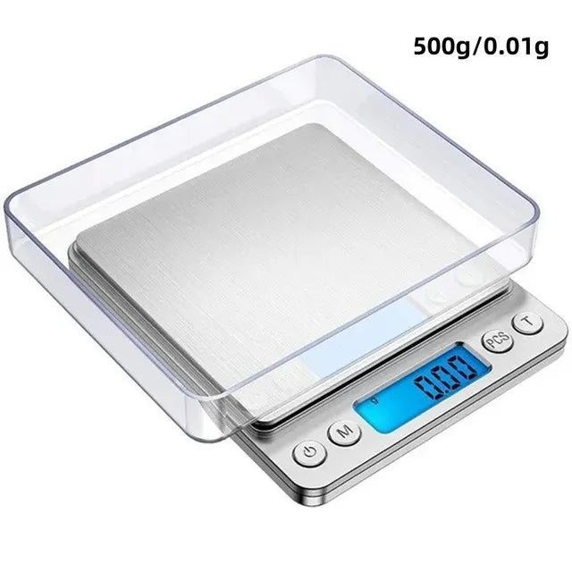 A clear plastic container holding a silver weighing pan on a digital kitchen scale.