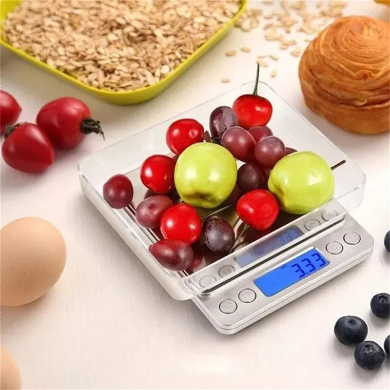 A precision digital kitchen scale is shown measuring various fruits and vegetables on a white surface.
