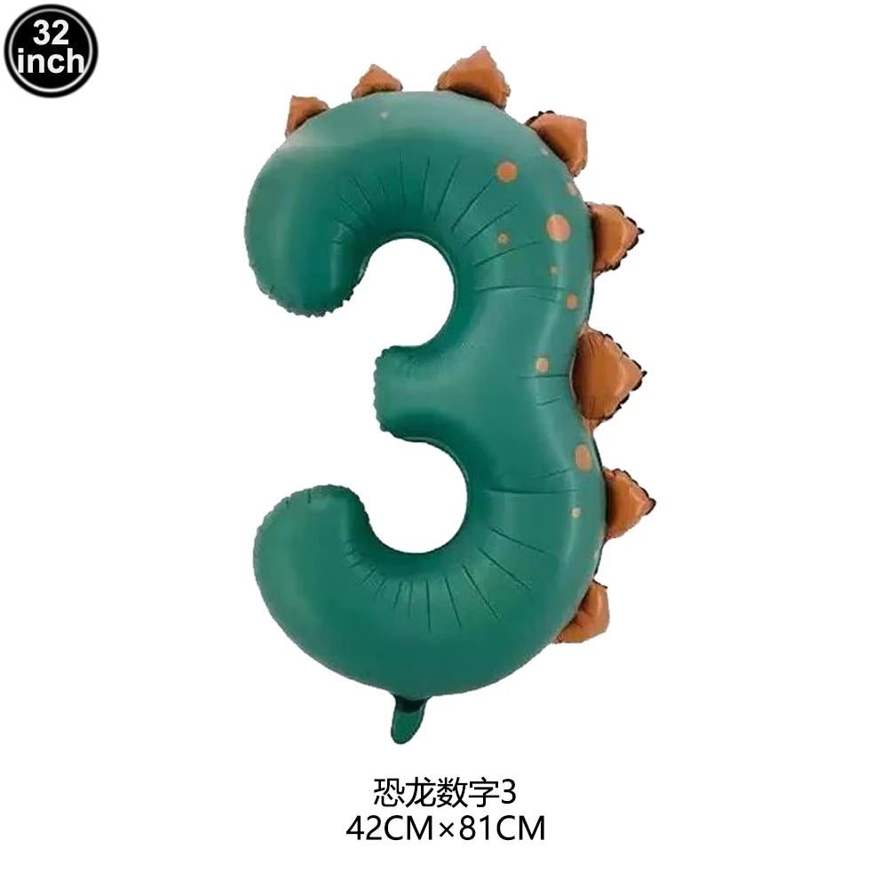 A green inflatable number three shaped like a dinosaur cupcake topper