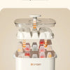 A white double-layer ice cube maker with a clear lid and multiple ice cube trays.