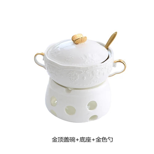 Luxuriöse goldvergoldete Keramik-Dessertschalen mit Deckel und einer kleinen weißen Keramikschale.