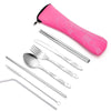 A pink storage case holding a set of stainless steel cutlery including a fork, knife, and spoon.