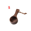 A natural wooden coffee measuring spoon with a handle and twine tie.