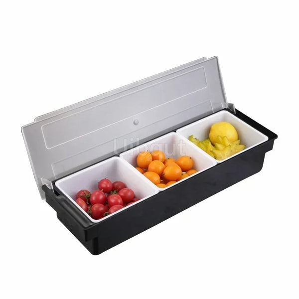 Schwarzer 6-fach Edelstahlbehälter für Gewürze und Condiments, gefüllt mit frischen Tomaten und Zitronen.