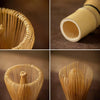 Close-up view of a natural bamboo tea tools set showing various components like a whisk and a cylindrical tool.