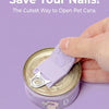 A hand is using a purple silicone tool to open a pet can, demonstrating a way to save nails.