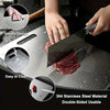 A hand is using a stainless steel double-sided cutting board to slice raw meat.