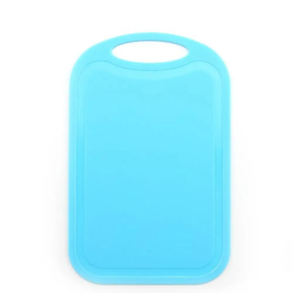 A bright blue non-slip plastic cutting board with a hanging handle.