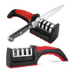 A silver kitchen knife sharpener with a red and black handle is shown in a profile view.