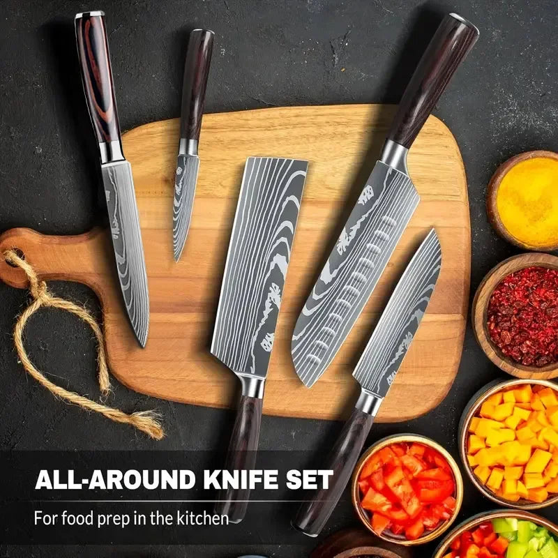 An all-around set of Damascus steel Japanese kitchen knives laid out on a wooden cutting board with surrounding ingredients.