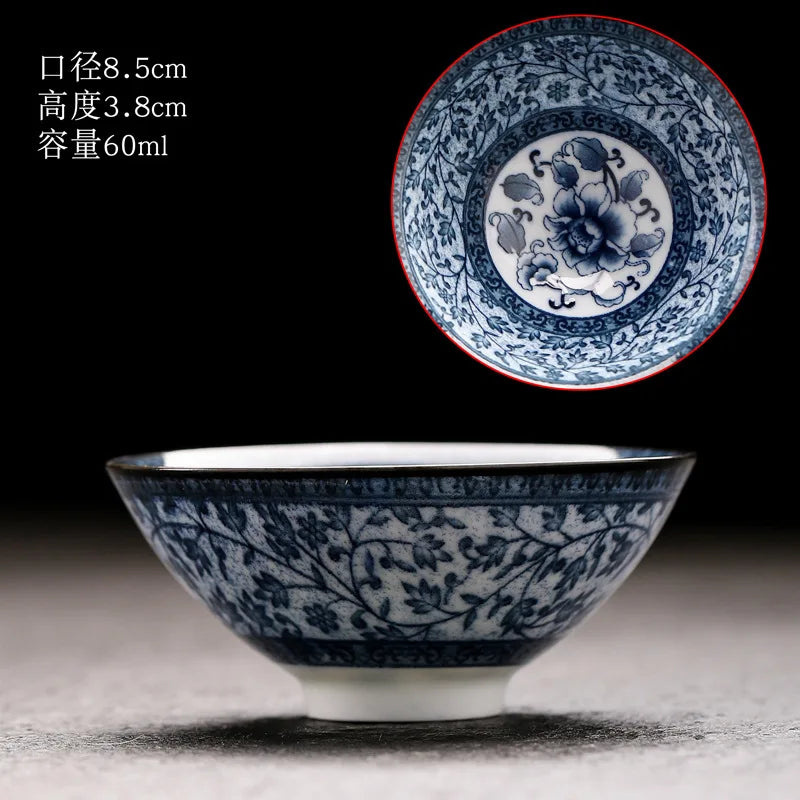 A handmade blue and white porcelain bowl shown against a dark background.