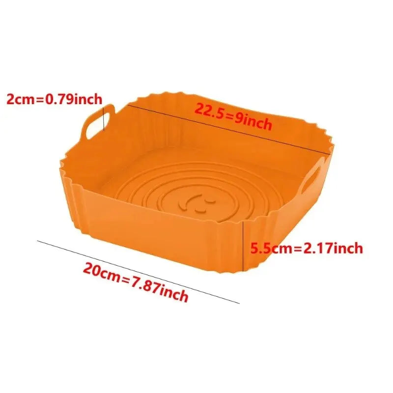 Orange reusable silicone air fryer liner basket with dimension markings.