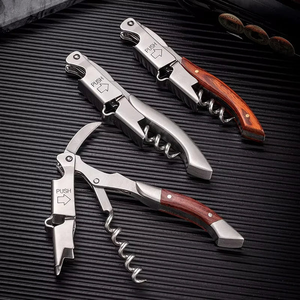 A set of double-hinged waiter's corkscrews with foil cutters featuring silver blades and wooden handles.