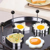 Stainless steel fried egg mold for omelettes and pancakes shown on a black plate