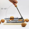 A hand is operating a stainless steel manual nut cracker, demonstrating a 35-45 degree angle.