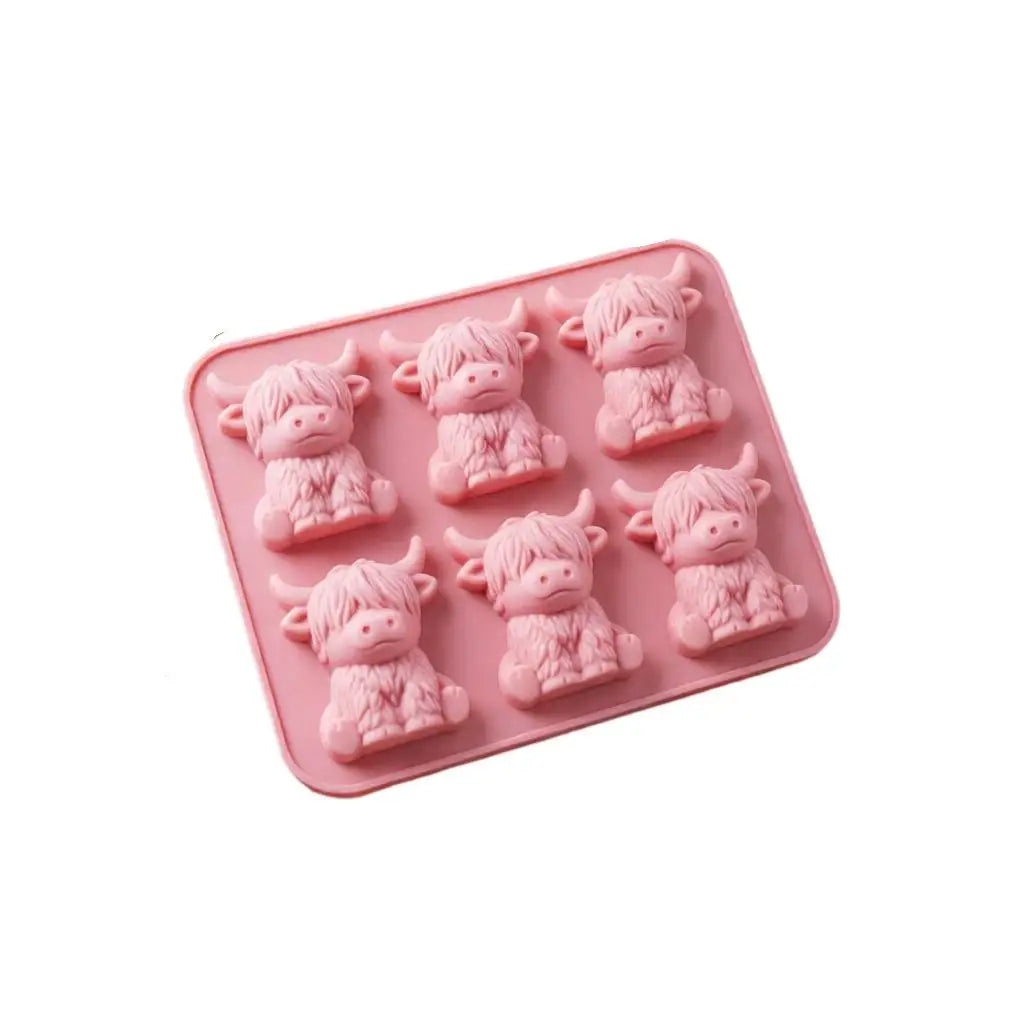 A pink silicone ice cube mold set designed for whiskey and coffee