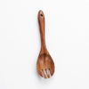 A single natural teak wooden cooking spoon with a handle and three prongs.