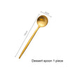 A single matte gold stainless steel dessert spoon with dimensions marked.