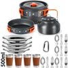 A set of camping cookware including a pot, lid, and several stainless steel frying pans and cups.