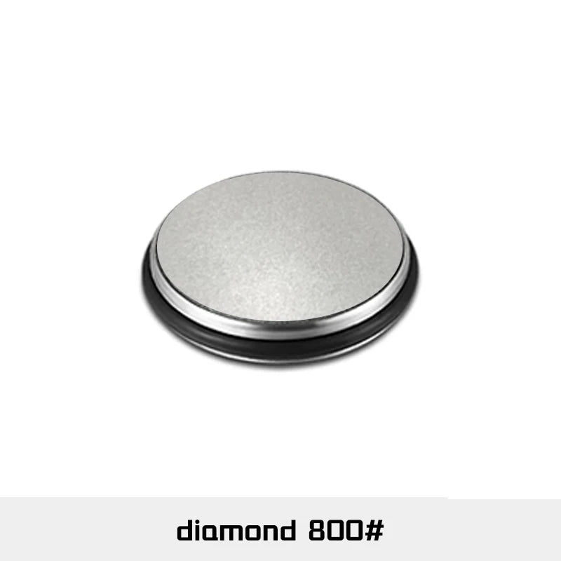 A round, silver-gray sharpening roller with a black rim.