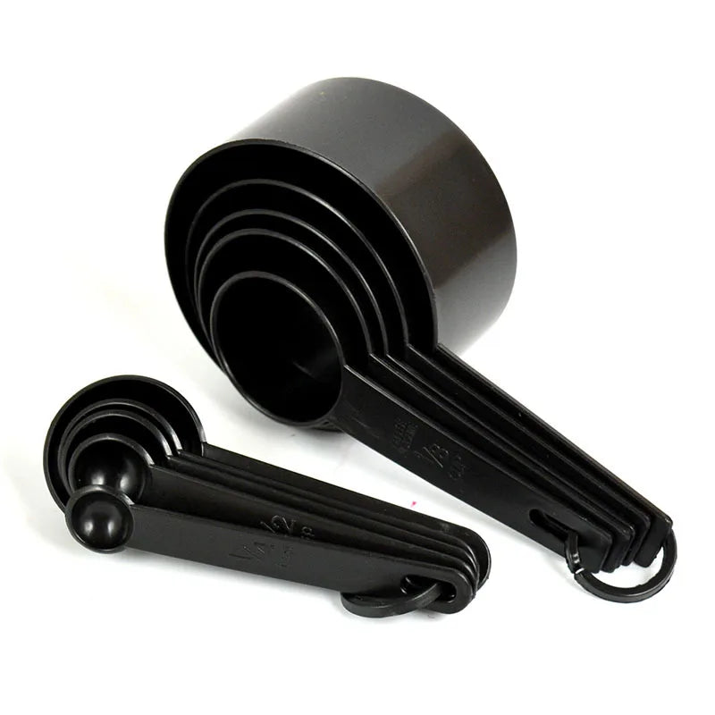 A black precision kitchen measuring tools set featuring a funnel and a handle.