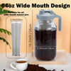 A 64oz wide mouth mason jar pitcher with a stainless steel filter and a handle, shown next to a measuring cup.